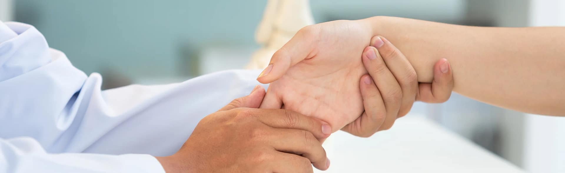 Doctor examing hand and wrist