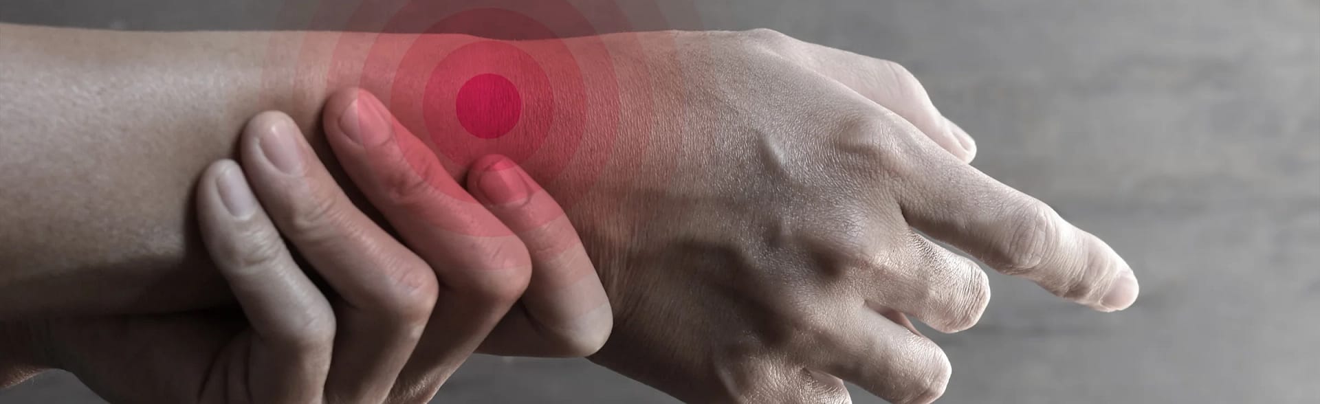 Person holding a wrist due to scaphoid fracture.